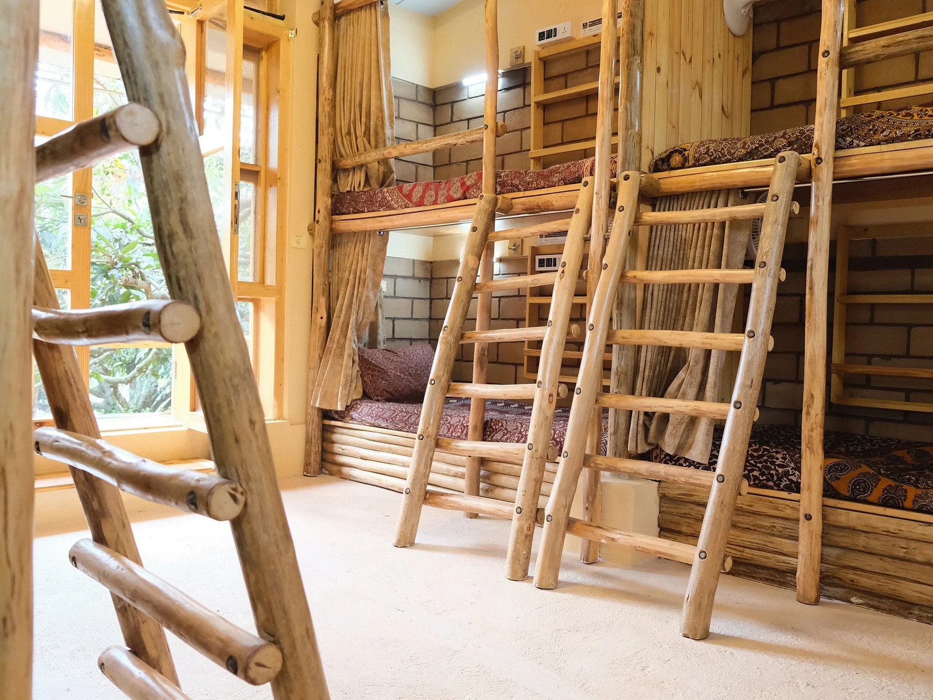 Wooden ladders leading to the bunk beds at Reflections.